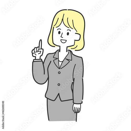 上を指差しているスーツの女性