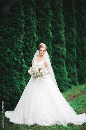 Luxury wedding bride, girl posing and smiling with bouquet