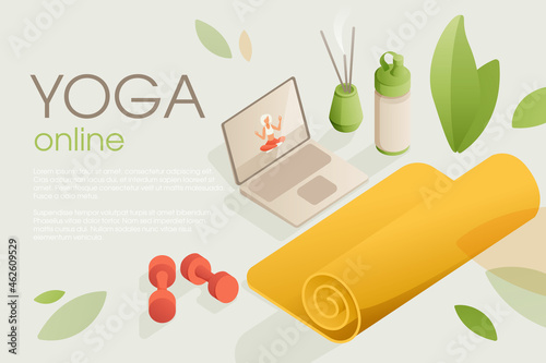 Set of yoga equipment for home training with a video lesson on the laptop.