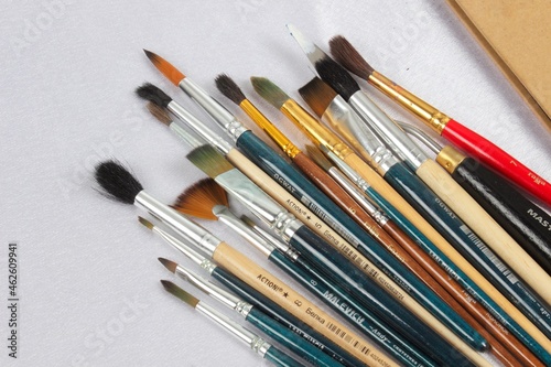 Photos of paint brushes, artist's tools on a white background