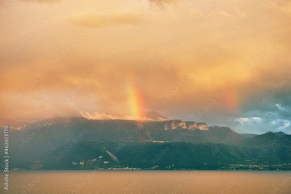 Beautiful sunset with rainbow over Alps, Haute-Savoie region