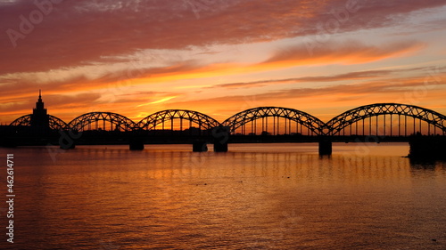 Fototapeta Naklejka Na Ścianę i Meble -  Railway bridge in Riga against the background of dawn in autumn.