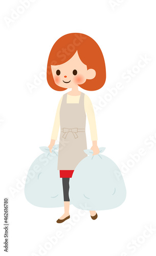 ゴミ出しをする主婦