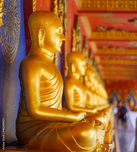A long row of Golden Buddha in Thailand