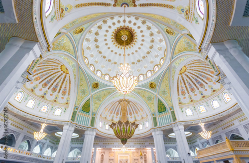 White mosque in city of Shali Chechen republic, RUSSIA. The Pride of Chechnya - the largest mosque in Europe. The interior is decorated with Swarovski. The carpet is made of New Zealand wool photo