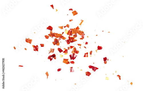 Crushed red cayenne pepper, dried chili flakes and seeds pile isolated on white background, top view photo
