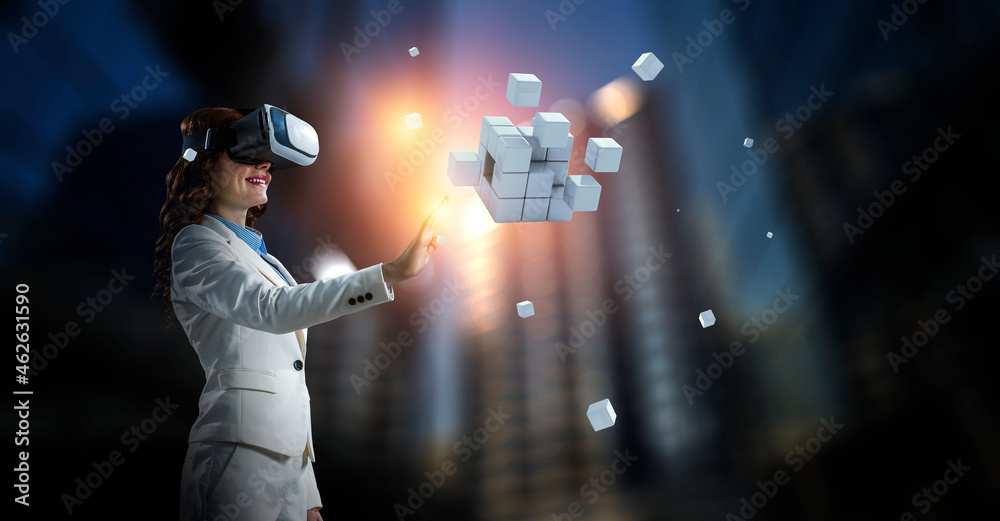 Woman wearing virtual reality goggles - obrazy, fototapety, plakaty 