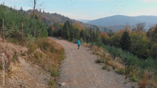 Lonely walk in autumn mountains
