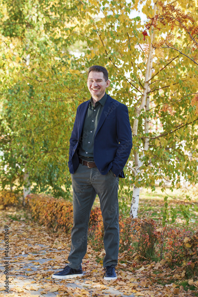 Full body portrait of a young brunette man