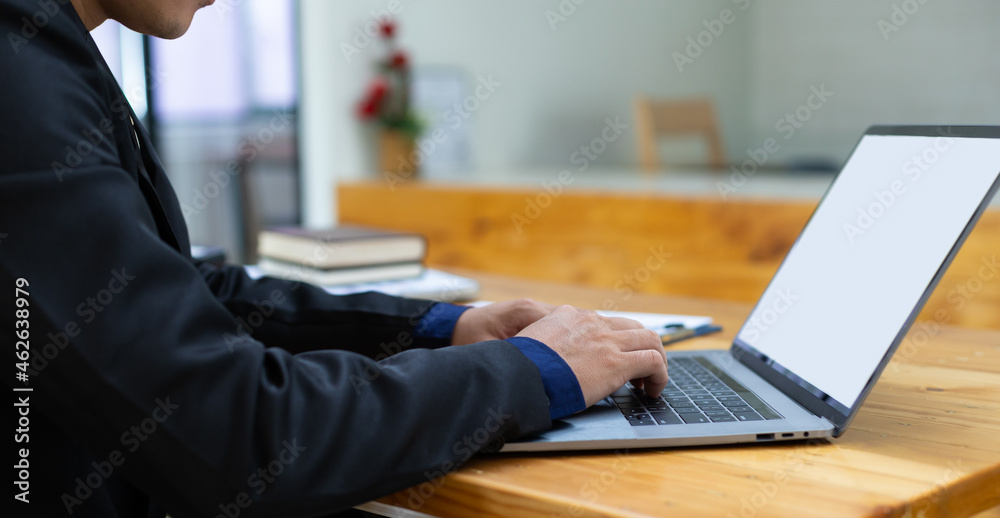 Close-up business man working on laptop in office. Close-up business man working on laptop in office.