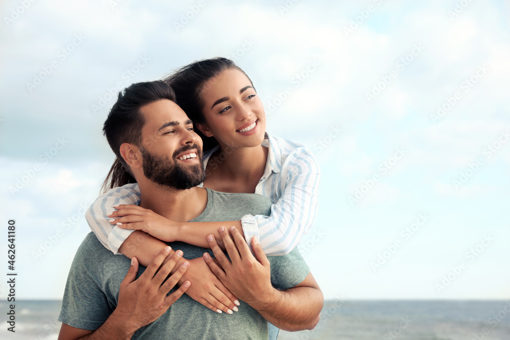 Lovely couple spending time together near sea Lovely couple spending time together near sea
