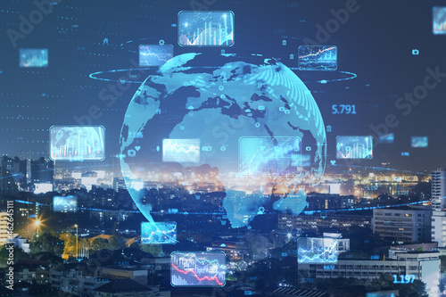 Abstract globe with forex charts and graphs on blurry night city background. Global trading and market concept. Double exposure.