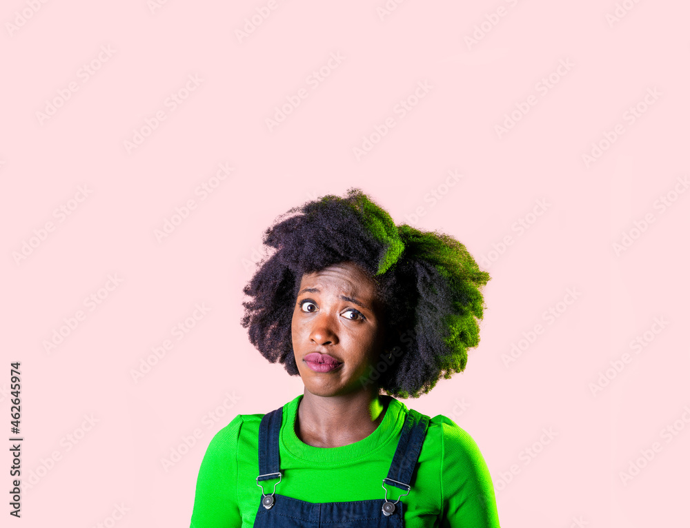 Portrait young black woman looking perplexed and confused isolated advertising copyspace background Portrait young black woman looking perplexed and confused isolated advertising copyspace background