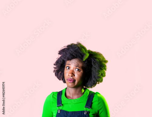 Portrait young black woman looking perplexed and confused isolated advertising copyspace background