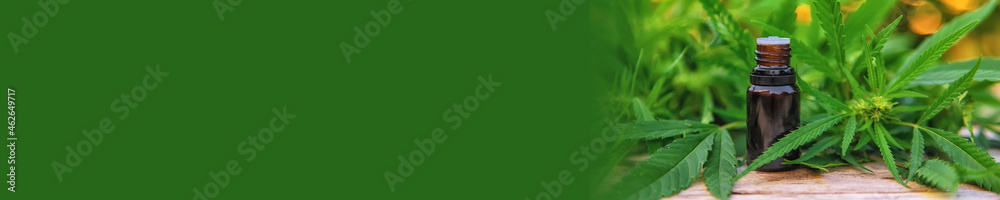Marijuana oil in a small bottle. Selective focus. Marijuana oil in a small bottle. Selective focus.