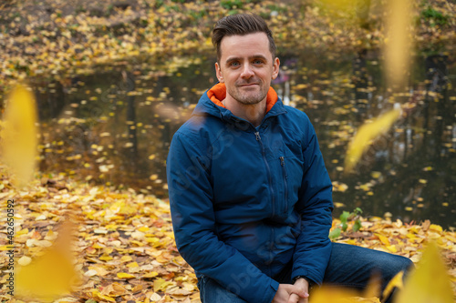 Autumn portrait of man on fall nature background
