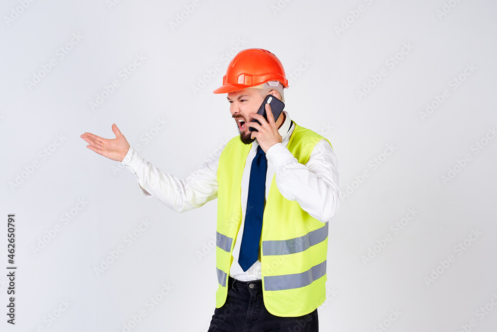Screaming worker or construction worker in a helmet on a white background.