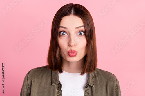 Photo of sweet brunette hairstyle millennial lady blow kiss wear jeans shirt isolated on pink color background