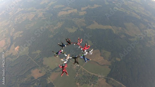 Skydiving.  Skydivers are making formation in the sky.