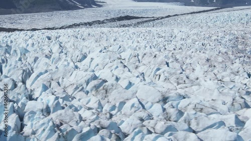 Aerial of Bear Glacier at the end of a fjord in Kenai Fjords National Park, Alaska