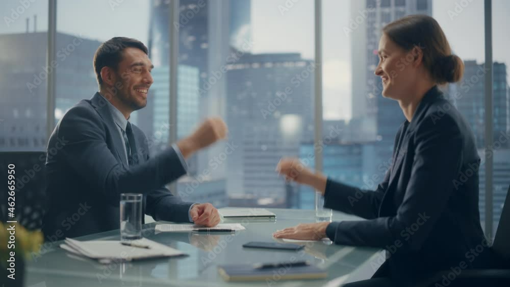 Female and Male Business Partners Have Fun and Play Rock Paper Scissors while Meeting Discussing Corporate Strategy, Financial Reports and Marketing Projects. Corporate Decisions Rely on Chance. Female and Male Business Partners Have Fun and Play Rock Paper Scissors while Meeting Discussing Corporate Strategy, Financial Reports and Marketing Projects. Corporate Decisions Rely on Chance.