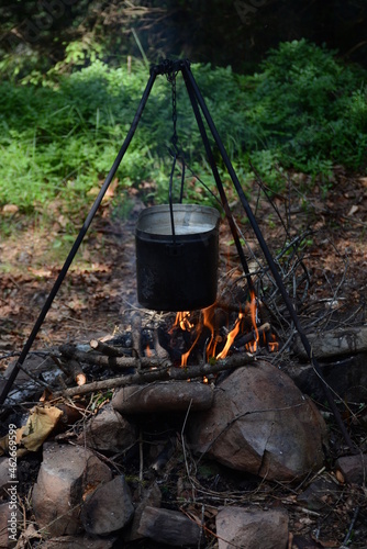 Cooking delicious liquid food on fire in natural conditions