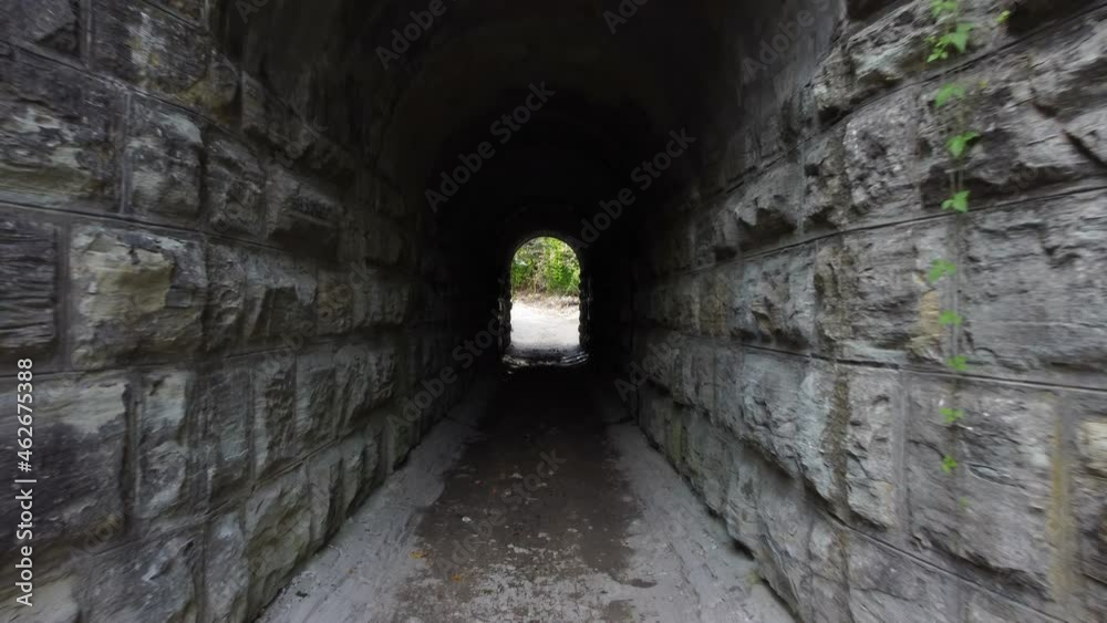 smooth movement inside the dark tunnel at the end of which sunlight. a metaphor for hope. light at the end of the tunnel smooth movement inside the dark tunnel at the end of which sunlight. a metaphor for hope. light at the end of the tunnel