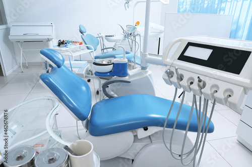Dentist s office interior with chair and modern equipment