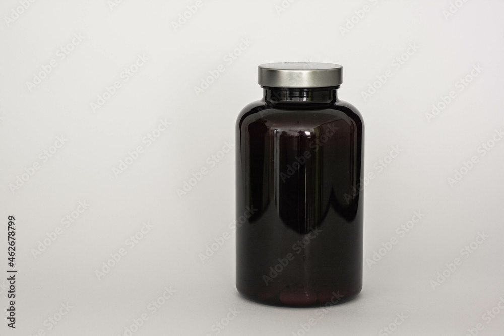 Black Plastic Bottle for Pills Packing with Chrome Metallic Lid. Black Plastic Bottle for Pills Packing with Chrome Metallic Lid.