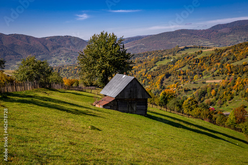 Wooden house for tourists in the autumn Carpathian mountains.