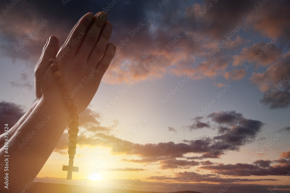 Christian human hands holding a cross holy and worship Pray to God with a  natural background. Stock Photo | Adobe Stock
