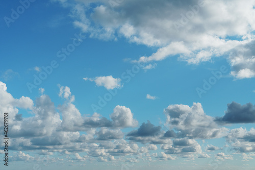 Blue sky with cumulus clouds over the sea