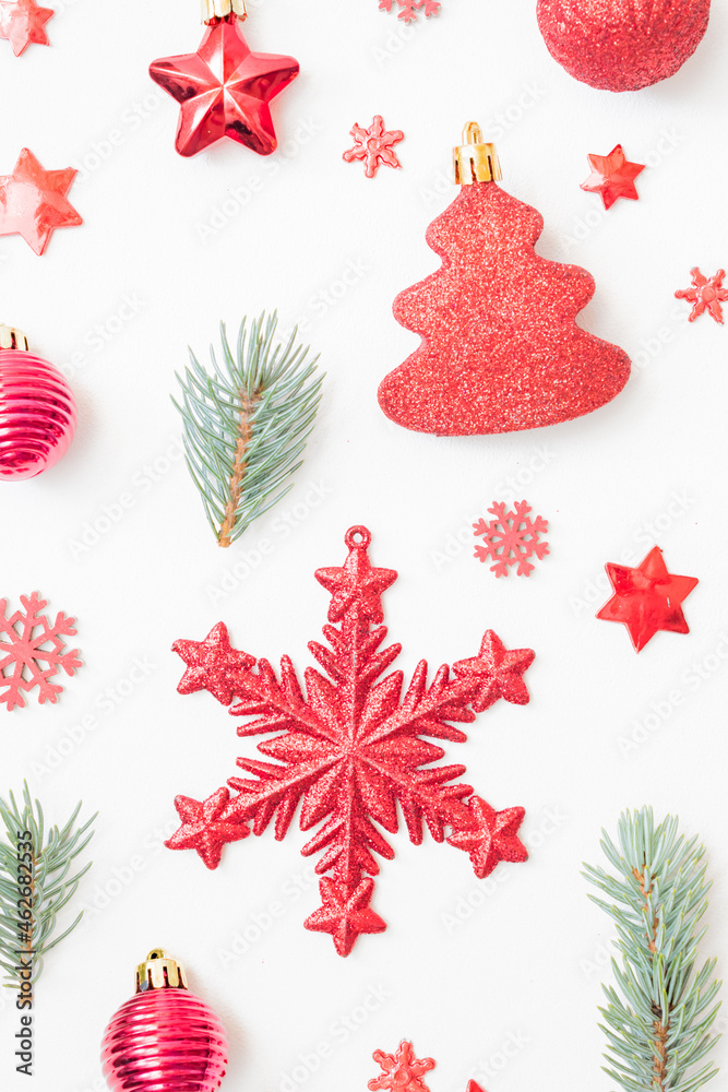 Flat lay pattern with fir branches, christmas balls and decorations on a white background Flat lay pattern with fir branches, christmas balls and decorations on a white background