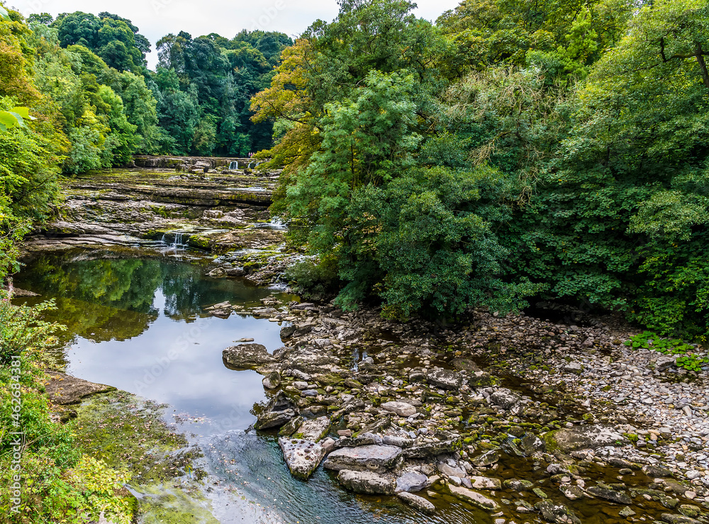 A view towards the upper Aysgarth falls, Yorkshire, UK on a summers day A view towards the upper Aysgarth falls, Yorkshire, UK on a summers day