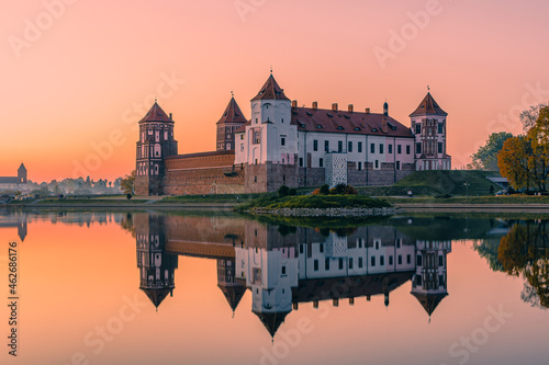 Mir Castle and its reflection against the purple sunset sky, Belarus.