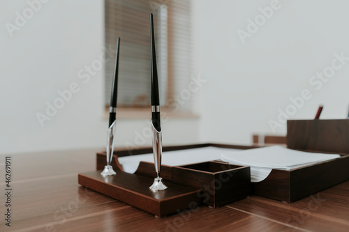 Neat wooden desk in office photo