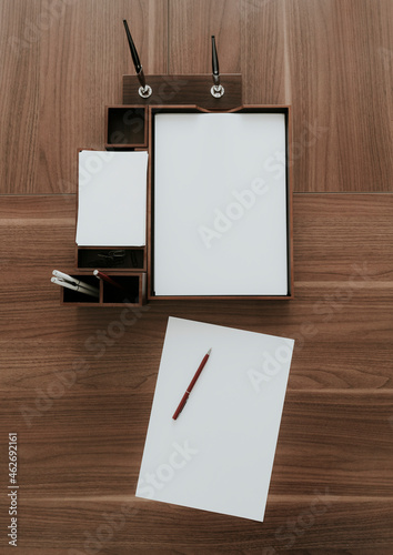 Top view of neat wooden desk in office photo