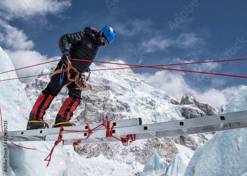 Nepal, Solo Khumbu, Everest, Mountaineer climbing on icefall photo