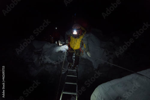 Nepal, Solo Khumbu, Maountaineer climbing Everest Icefall at night photo