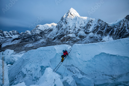 Nepal, Solo Khumbu, Mountaineer at Everest Icefall, Pumori in background photo