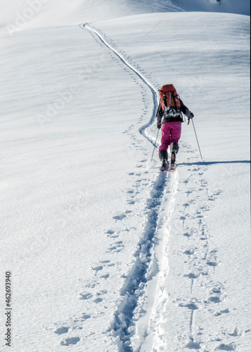 Switzerland, Bagnes, Cabane Marcel Brunet, Mont Rogneux, woman ski touring in the mountains