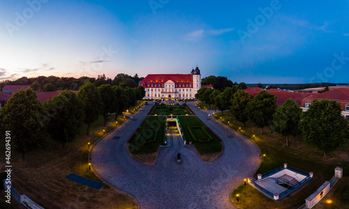 Germany, Mecklenburg-Western Pomerania, Mecklenburg Lake District, Goehren-Lebbin, Aerial view of Castle Hotel Fleesensee in the evening photo