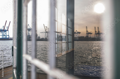 Germany, Hamburg, Ovelgonne, Port on river Elbe reflected in window photo