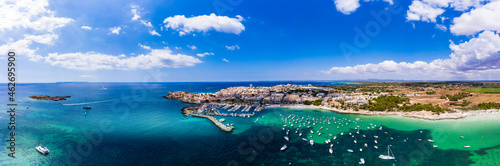 Spain, Balearic Islands, Colonia de Sant Jordi, Aerial panorama of Mediterranean Sea and coastal town in summer photo