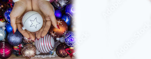 girl holding New Year's toys gifts in her hands. Christmas concept