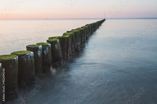 Germany, Mecklenburg-Western Pomerania, Wustrow, Baltic Sea, breakwater in the evening in winter
