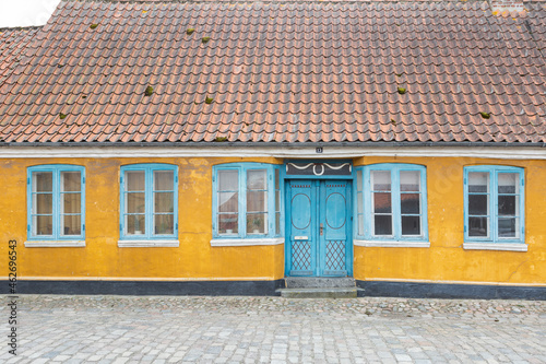 Denmark, Ribe, Facade of old town house with tiled roof photo