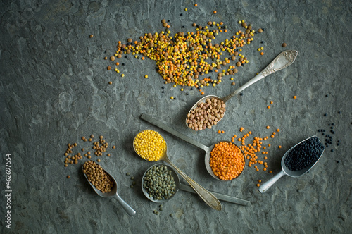 Spoons of colorful lentils photo
