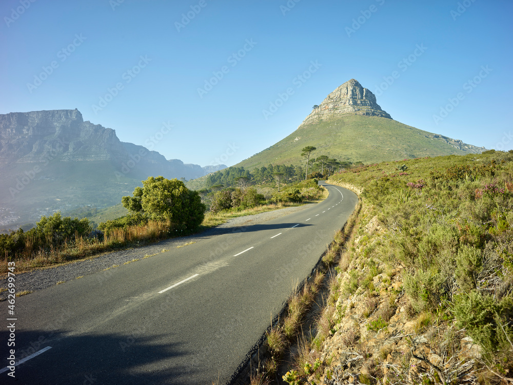 Empty asphalt road toward Lions Head mountain, Cape Town, South Africa