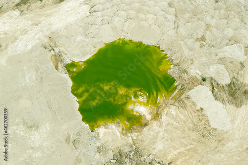 Papier peint Green lake formed at the site of a sand pit